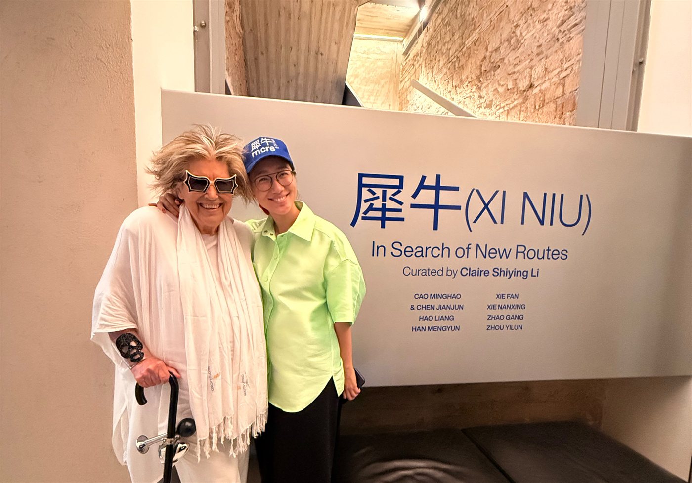 Alda Fendi and curator Claire Shiying Li at the opening, beside the exhibition title wall