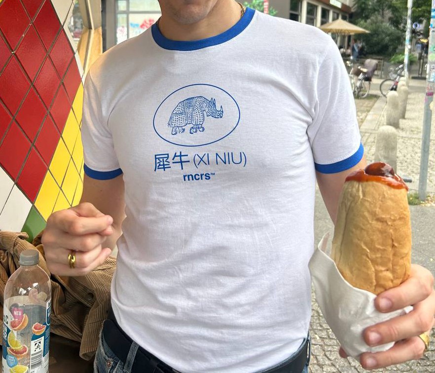 Xi Niu t-shirt, front, worn on the street